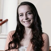 Smiling young woman with long, dark hair